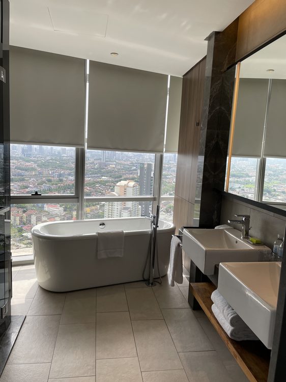 The Le Meridien Suite offers an unparallel city skyline view while luxuriating in a bath tub