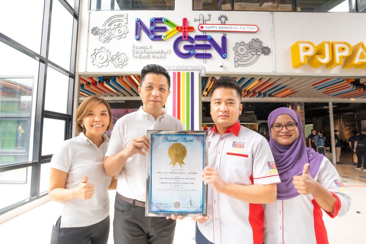 Founders of NEXTGEN, Lilian and Leroy all smiles as they receive their certification from the Malaysian Book of Records.